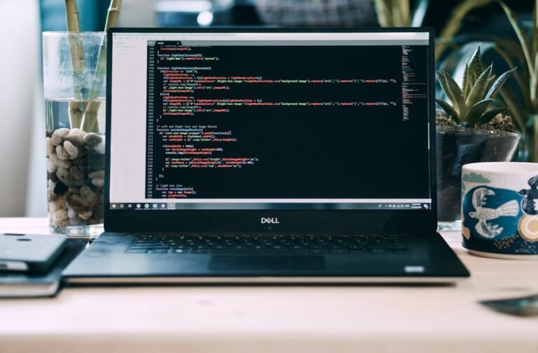 A laptop computer sitting on a desk