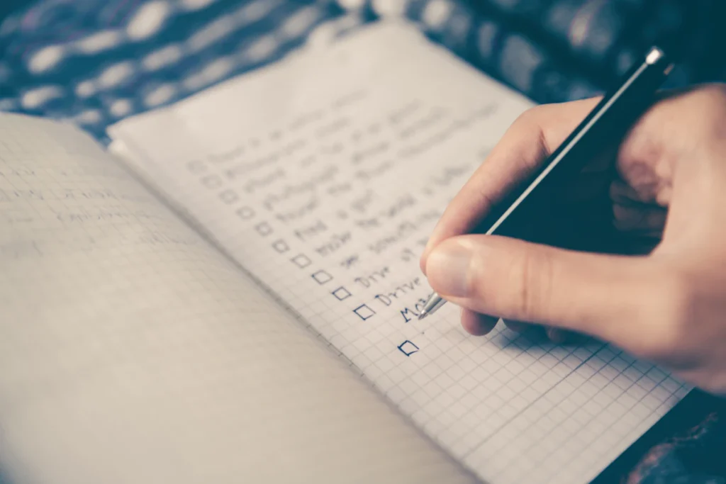 A handwritten task checklist being reviewed