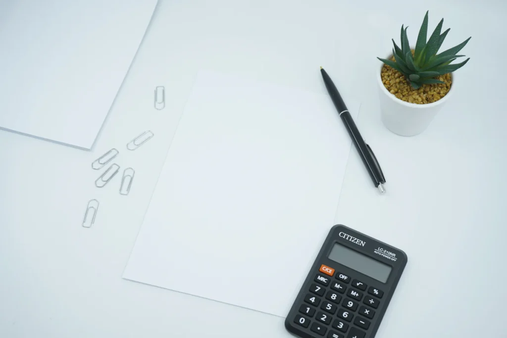 Calculator and paper for comparing project budgets