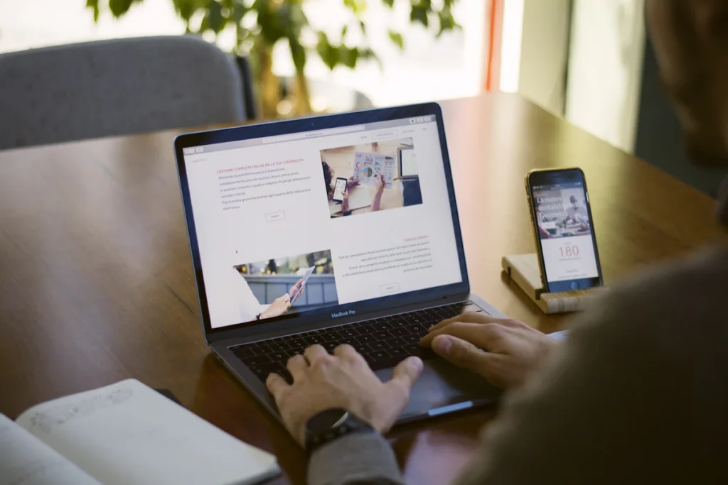 A person reviewing a website on a laptop